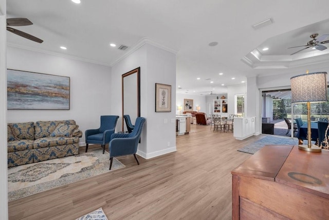 5507 Keeler Oak St, Lithia, FL 33547 - living room with a ceiling fan, crown molding, light wood finished floors, recessed lighting, and a raised ceiling