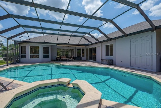 5507 Keeler Oak St, Lithia, FL 33547 - view of swimming pool with a patio, a pool with connected hot tub, and glass enclosure