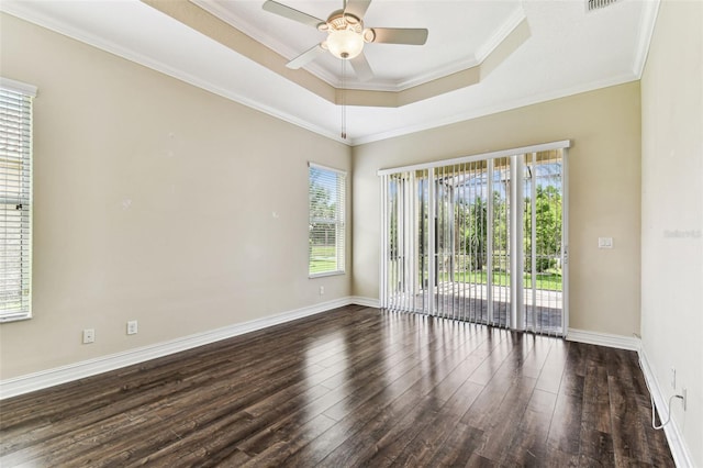 16101 Cape Coral Dr, Wimauma, FL 33598 - unfurnished room featuring healthy amount of natural light, wood finished floors, a ceiling fan, baseboards, and crown molding