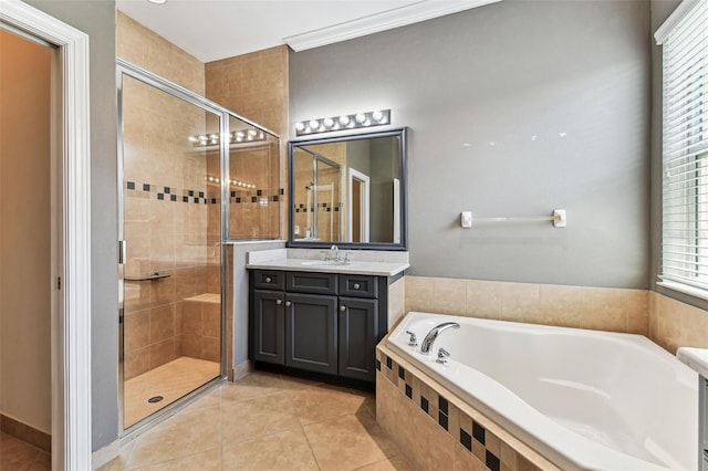 16101 Cape Coral Dr, Wimauma, FL 33598 - bathroom with a shower stall, a bath, tile patterned floors, and vanity