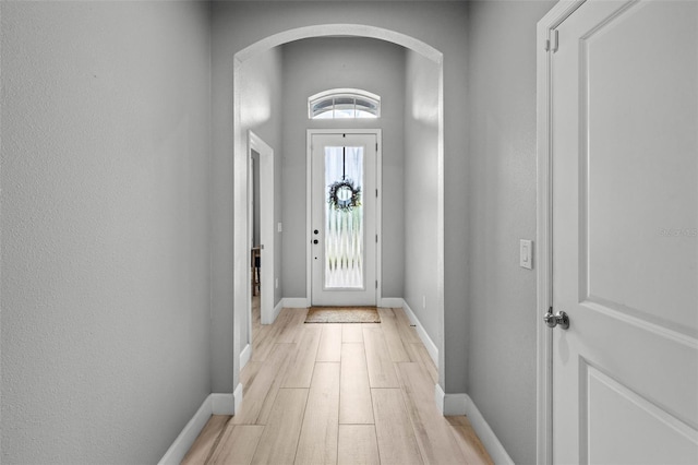 11322 Lake Lucaya Dr, Riverview, FL 33579 - entryway with arched walkways, light wood-type flooring, and baseboards