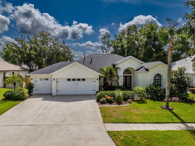 4612 River Overlook Dr, Valrico, FL 33596 - ranch-style home featuring a garage, concrete driveway, a front lawn, and stucco siding