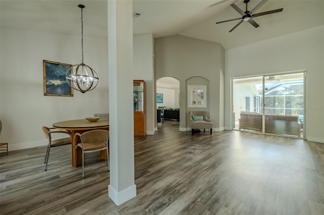 4612 River Overlook Dr, Valrico, FL 33596 - dining area with high vaulted ceiling, ceiling fan, wood finished floors, a chandelier, and arched walkways