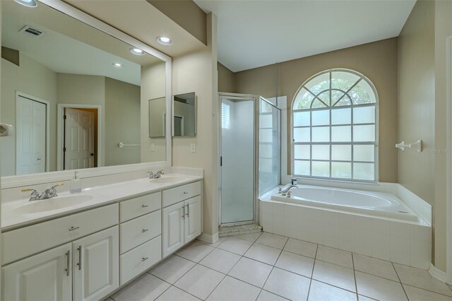 4612 River Overlook Dr, Valrico, FL 33596 - full bath with double vanity, a shower stall, a bath, tile patterned floors, and recessed lighting