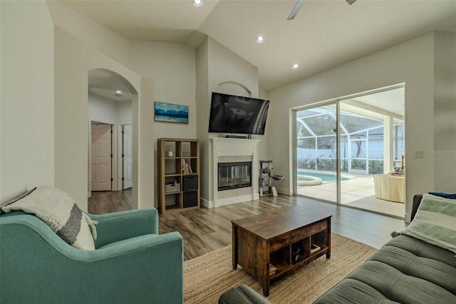 4612 River Overlook Dr, Valrico, FL 33596 - living area featuring ceiling fan, vaulted ceiling, wood finished floors, arched walkways, and recessed lighting