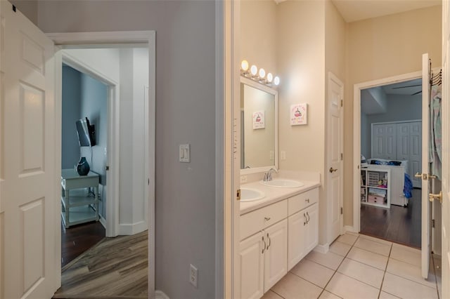 4612 River Overlook Dr, Valrico, FL 33596 - bathroom featuring double vanity and wood finished floors