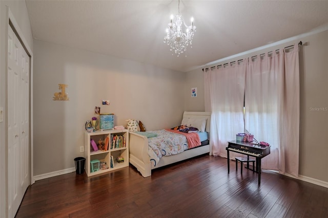 4612 River Overlook Dr, Valrico, FL 33596 - bedroom featuring a chandelier, wood finished floors, and a closet