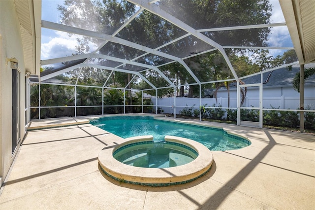 4612 River Overlook Dr, Valrico, FL 33596 - view of swimming pool featuring a patio area, a fenced backyard, a pool with connected hot tub, and glass enclosure