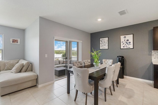 9532 Black Walnut Dr, Clermont, FL 34715 - dining space with baseboards, recessed lighting, and light tile patterned floors