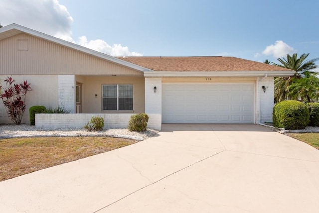 106 Silverbell Ct, Sun City Center, FL 33573 - ranch-style house featuring concrete driveway, an attached garage, and brick siding