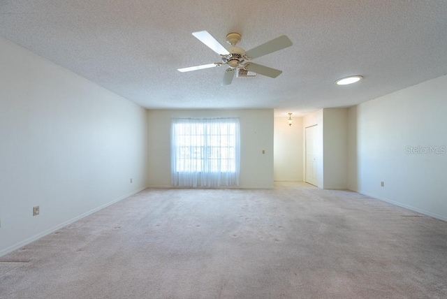 106 Silverbell Ct, Sun City Center, FL 33573 - spare room featuring a textured ceiling, carpet, ceiling fan, and baseboards