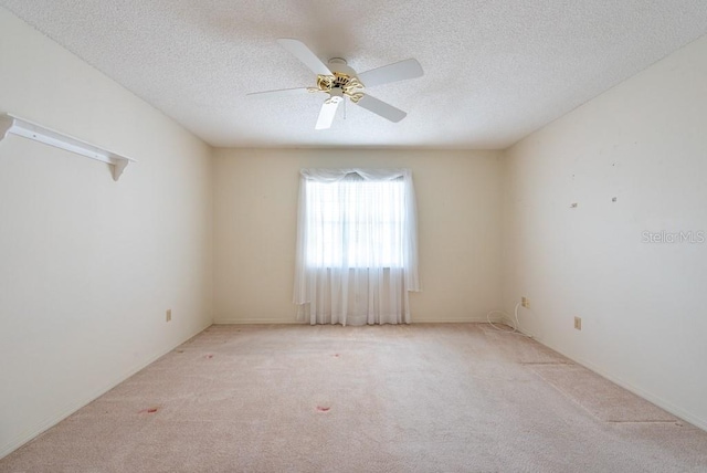 106 Silverbell Ct, Sun City Center, FL 33573 - empty room featuring carpet, a textured ceiling, and a ceiling fan