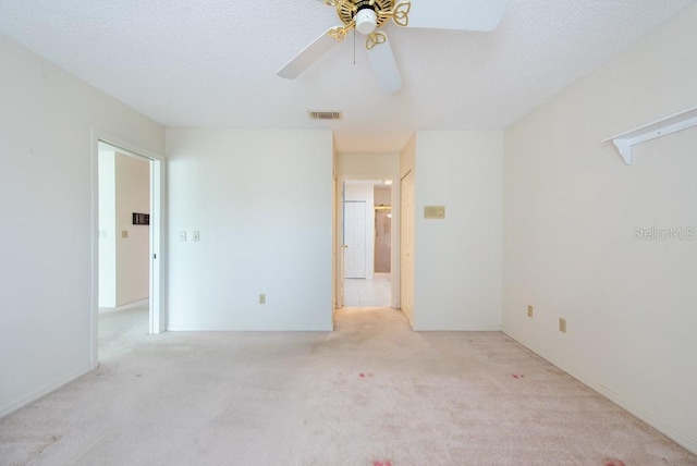 106 Silverbell Ct, Sun City Center, FL 33573 - empty room with carpet, a ceiling fan, and a textured ceiling