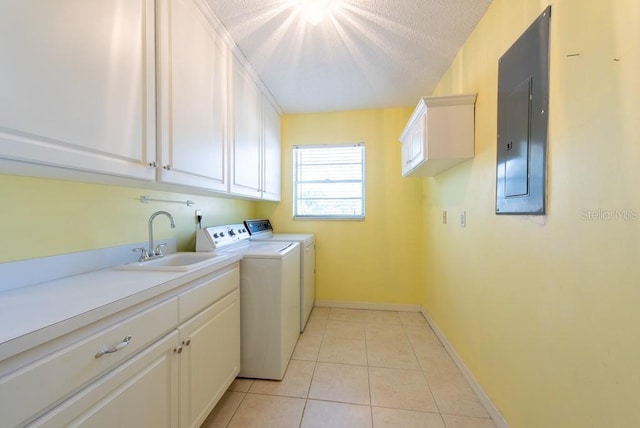 106 Silverbell Ct, Sun City Center, FL 33573 - laundry area featuring electric panel, independent washer and dryer, cabinet space, baseboards, and light tile patterned flooring