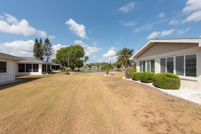 106 Silverbell Ct, Sun City Center, FL 33573 - view of grassy yard with a water view