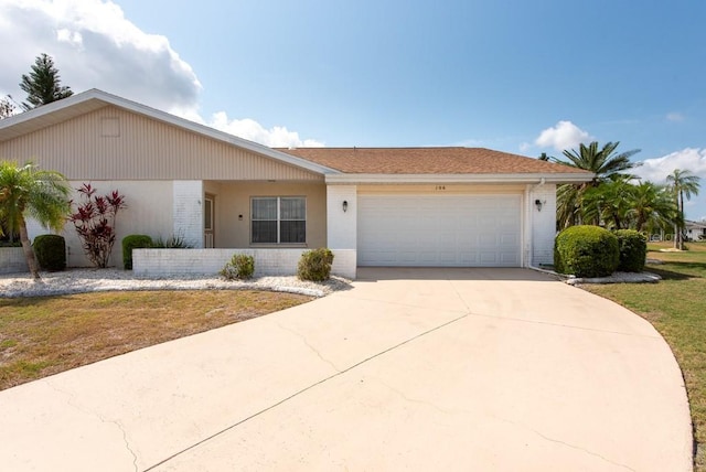 106 Silverbell Ct, Sun City Center, FL 33573 - ranch-style house featuring an attached garage and concrete driveway