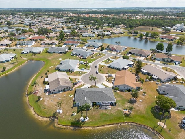 106 Silverbell Ct, Sun City Center, FL 33573 - aerial overview of property's location featuring nearby suburban area and a nearby body of water