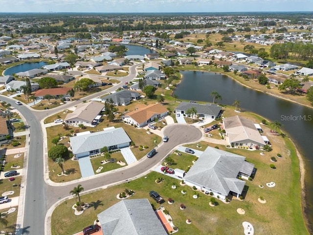 106 Silverbell Ct, Sun City Center, FL 33573 - aerial overview of property's location with a large body of water and nearby suburban area
