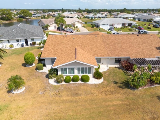 106 Silverbell Ct, Sun City Center, FL 33573 - aerial perspective of suburban area featuring a large body of water