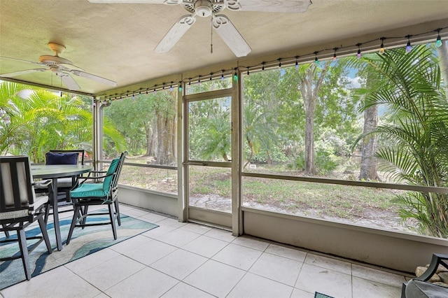 330 Woods Landing Trl, Oldsmar, FL 34677 - sunroom featuring ceiling fan and outdoor dining area