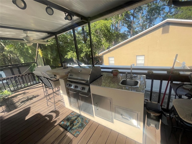 6073 115th Ave N, Pinellas Park, FL 33782 - wooden terrace featuring grilling area, a sink, exterior kitchen, and a ceiling fan