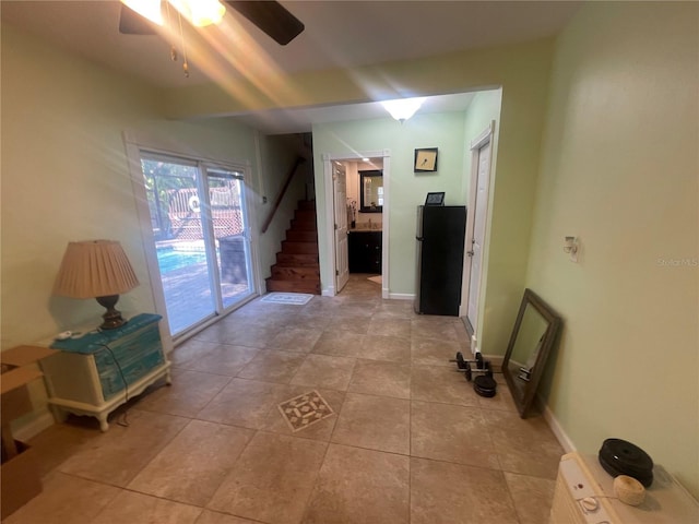 6073 115th Ave N, Pinellas Park, FL 33782 - hall featuring light tile patterned flooring, stairway, and baseboards