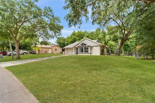 single story home featuring driveway and a garage