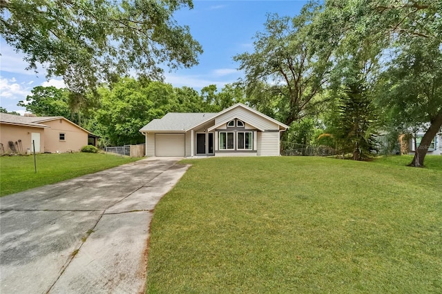 view of front facade with concrete driveway and a garage