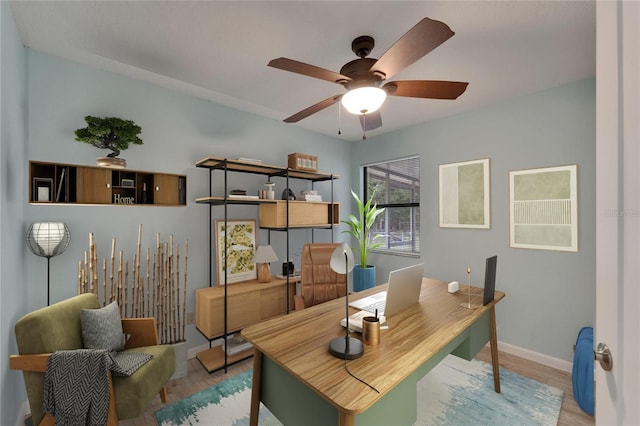 office space with wood finished floors, ceiling fan, and baseboards
