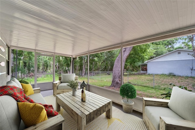 sunroom with outdoor lounge area and healthy amount of natural light