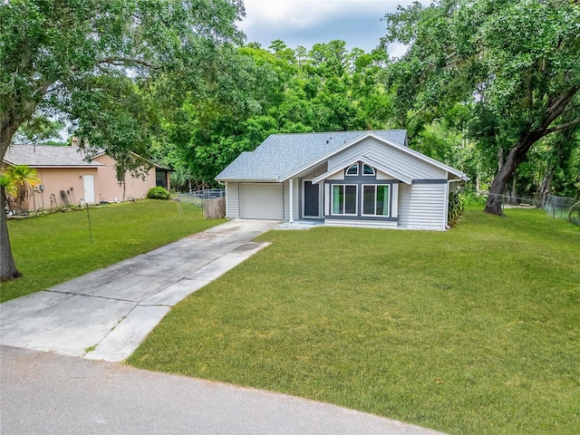 ranch-style home with driveway, an attached garage, and roof with shingles
