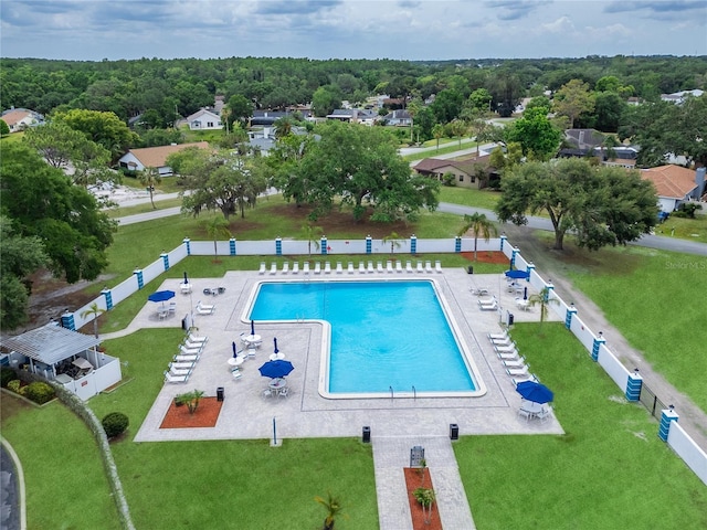 view of pool featuring a yard