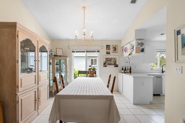 2413 Oxford Down Ct Unit 58, Sun City Center, FL 33573 - dining space featuring vaulted ceiling, a chandelier, light tile patterned floors, and a textured ceiling