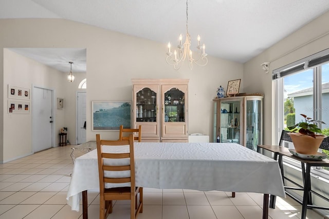 2413 Oxford Down Ct Unit 58, Sun City Center, FL 33573 - dining room featuring vaulted ceiling, a chandelier, and light tile patterned flooring