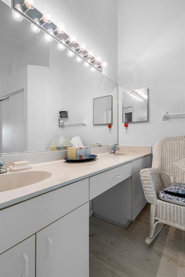 2413 Oxford Down Ct Unit 58, Sun City Center, FL 33573 - full bath with double vanity and wood finished floors