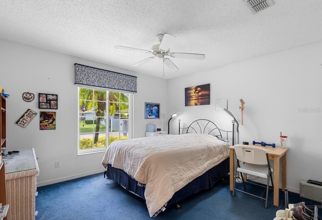 2413 Oxford Down Ct Unit 58, Sun City Center, FL 33573 - carpeted bedroom with a textured ceiling, baseboards, and ceiling fan