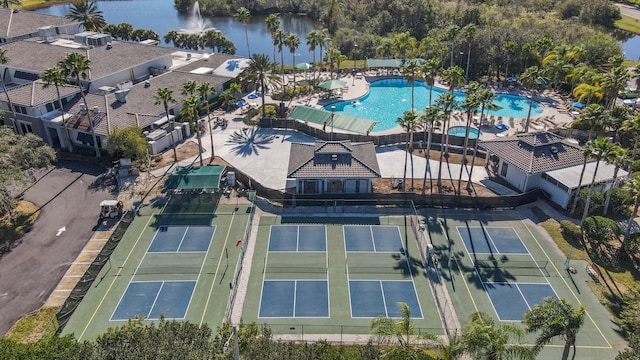 2413 Oxford Down Ct Unit 58, Sun City Center, FL 33573 - aerial view of property and surrounding area featuring a pool area and a large body of water
