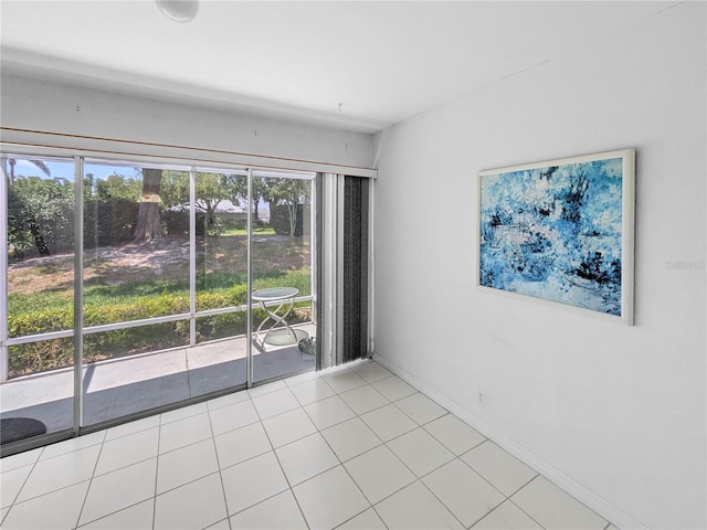2413 Oxford Down Ct Unit 58, Sun City Center, FL 33573 - tiled empty room featuring baseboards