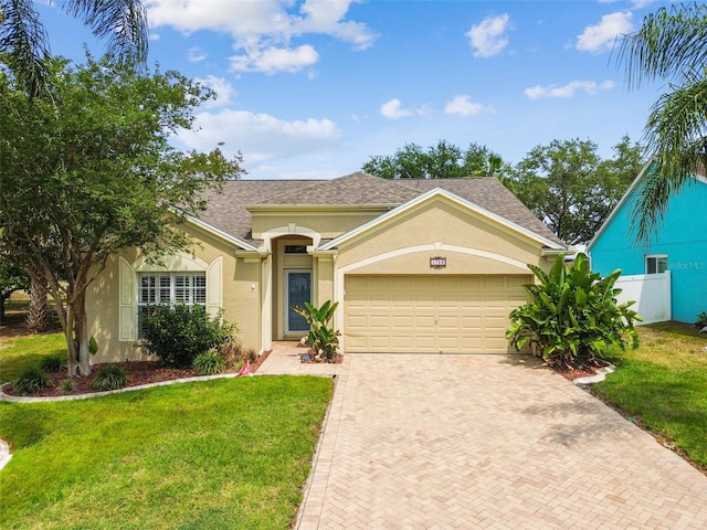 view of front of home featuring stucco siding, decorative driveway, an attached garage, and roof with shingles