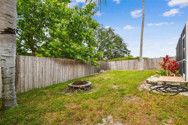 view of yard with an outdoor fire pit