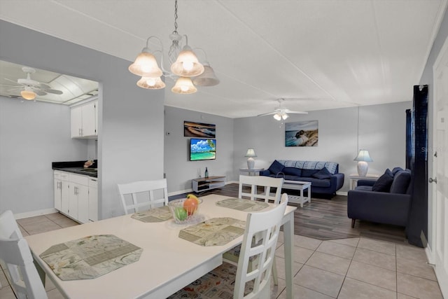 12760 Indian Rocks Rd Unit 578, Largo, FL 33774 - dining space with ceiling fan, light tile patterned floors, and a chandelier