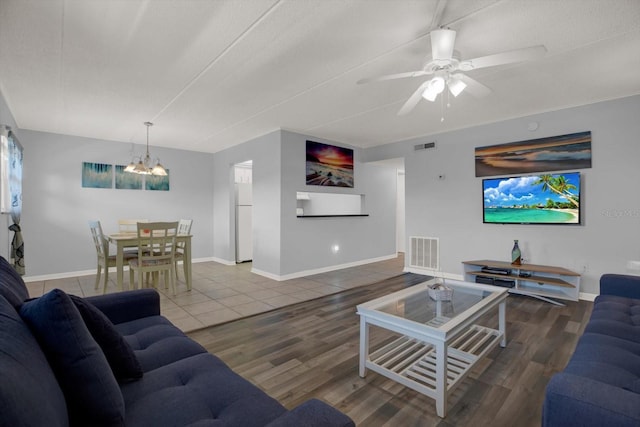 12760 Indian Rocks Rd Unit 578, Largo, FL 33774 - living room with a chandelier, baseboards, a ceiling fan, and wood finished floors