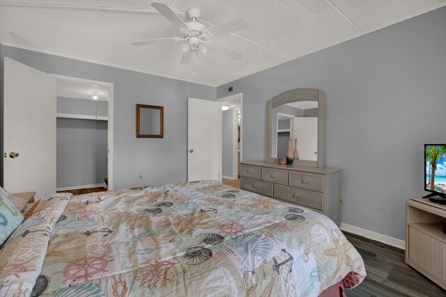 12760 Indian Rocks Rd Unit 578, Largo, FL 33774 - bedroom with wood finished floors, arched walkways, a closet, ceiling fan, and baseboards
