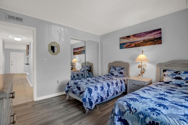 12760 Indian Rocks Rd Unit 578, Largo, FL 33774 - bedroom with wood finished floors, baseboards, a closet, and ornamental molding