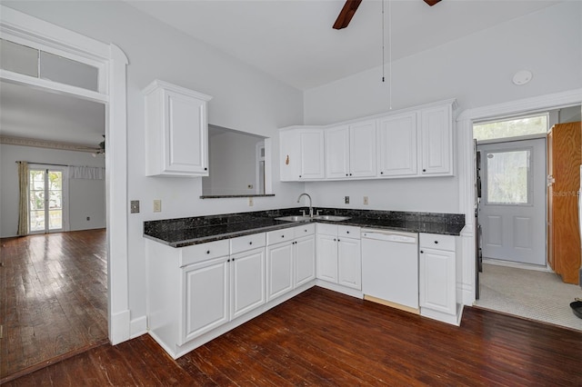 kitchen with a ceiling fan, white dishwasher, a sink, white cabinets, and dark wood finished floors