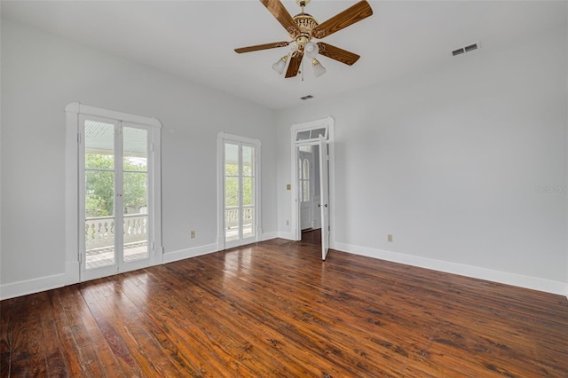 empty room with hardwood / wood-style flooring, baseboards, and ceiling fan