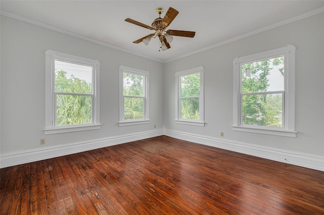 unfurnished room with baseboards, dark wood finished floors, ornamental molding, and ceiling fan
