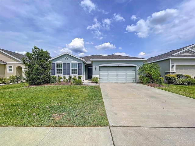 single story home featuring an attached garage, driveway, a front yard, and stucco siding