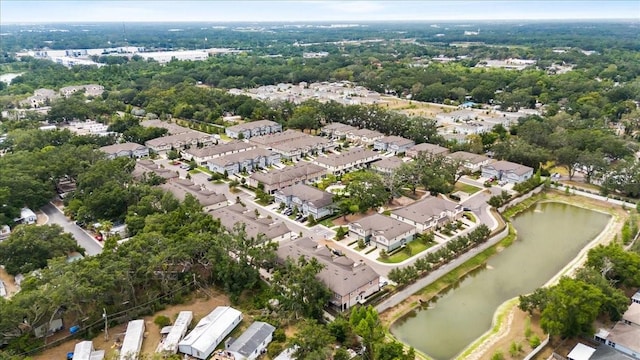 aerial overview of property's location featuring a nearby body of water and nearby suburban area