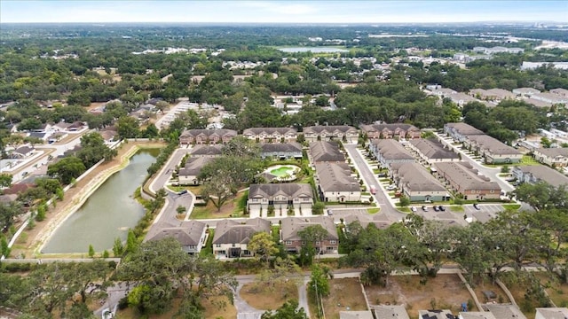 view of property location with a large body of water and nearby suburban area